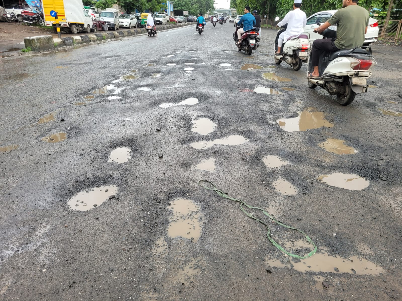 The Ramayana of potholes has now started in Surat city amid rainy  conditions, after the waterlogging every monsoon, people are troubled by  the rutted roads in all zones of the city. |