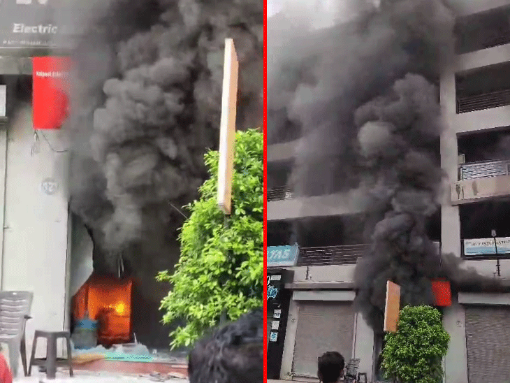 A fire broke out in an EV showroom in Ahmedabad and the glass broke due to  the explosion of batteries, spreading fear among people | ધડાકા થતાં  આસપાસની દુકાનો ખાલી કરાવી: અમદાવાદમાં