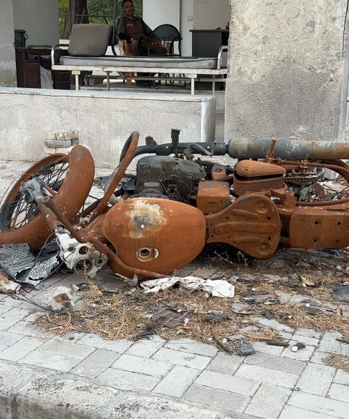Vehicles lying behind the hostel are still in the same condition as on June 12, 2025.