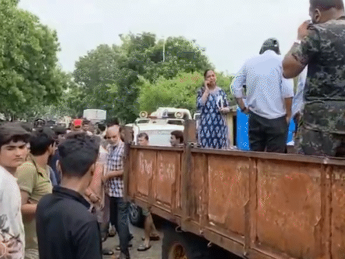 Locals stopped the tractor and asked the corporators and officials to walk barefoot in the water.