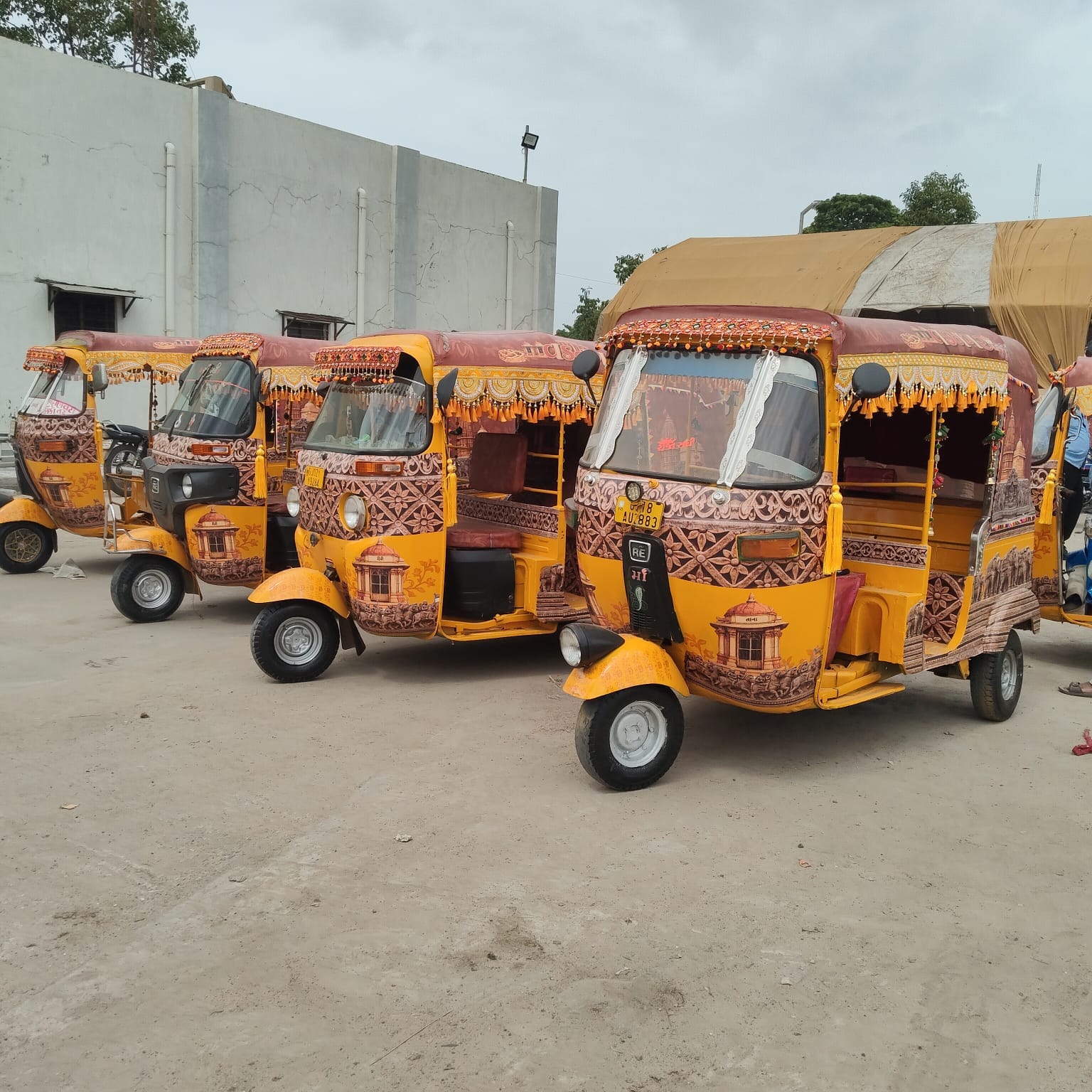 The identity of 'Anant Anadi Vadnagar' is on Vadnagar's rickshaws
