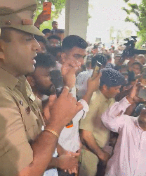 A police officer rushed over and tried to reason with the workers.